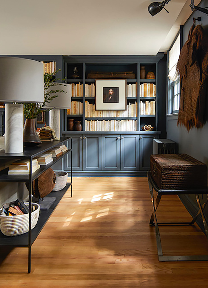 Built-in navy bookcases in Brooklyn brownstone