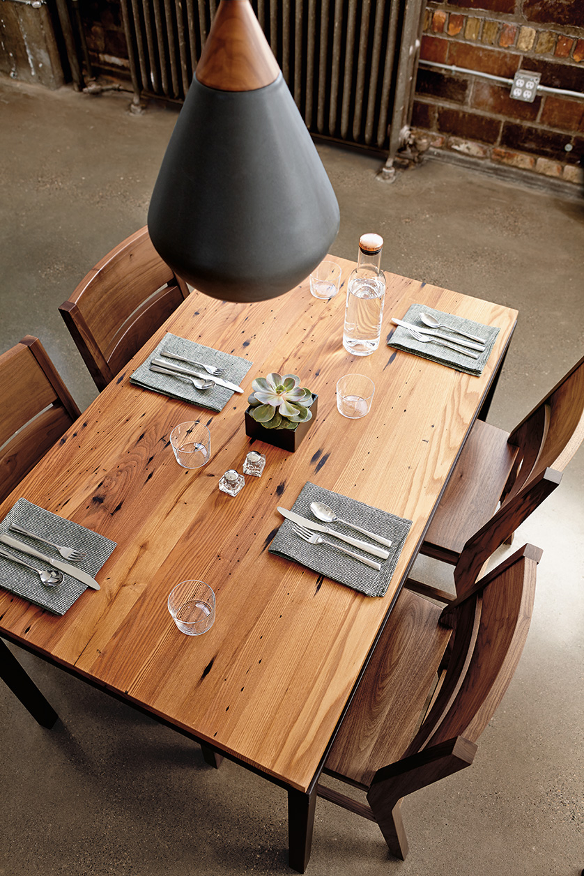 Dining room with Parsons table in natural steel and reclaimed chestnut.