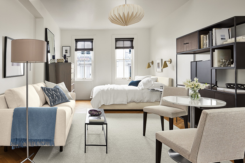 Studio with Jasper 71-wide loveseat, and Wyatt full bed in Sumner Ivory, Aria 27-diameter table, and Flannery rug in grey.