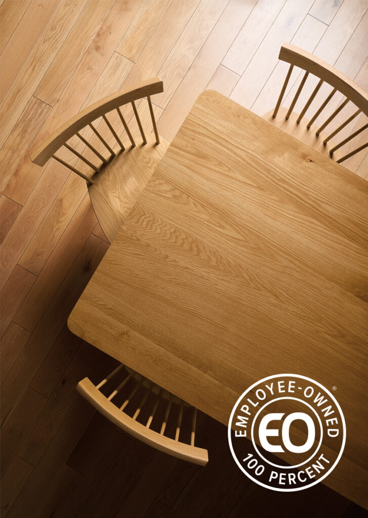 Top-down view of a Colby wood dining table and Thatcher chairs in white oak.